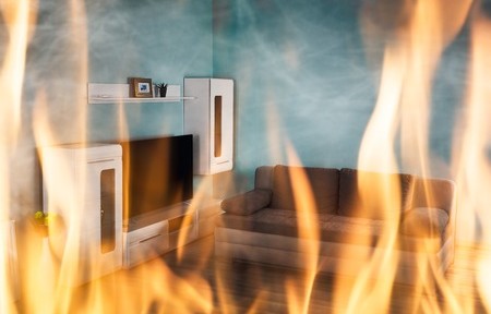 69611455 - close-up of fire burning inside the living room of the house